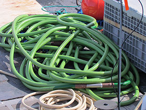 Photo of the multichannel seismic streamer (green) on the fantail deck of R/V Solstice.